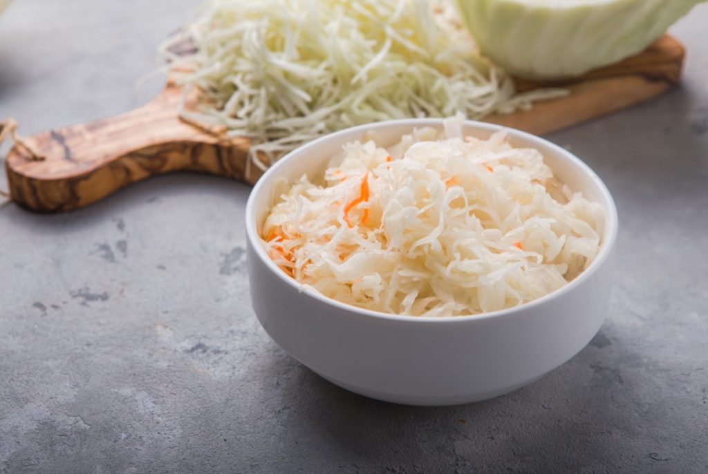 Homemade sauerkraut village fermented cabbage. Vegan salad rustic style  organic vegetable  great for good health. Traditional russian winter meal. Probiotics food concept.